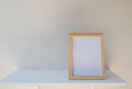 photo Frame on a wooden on White background .の写真素材