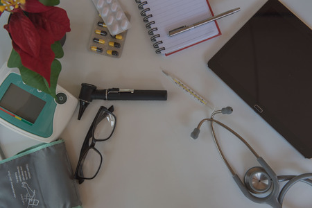 Top view stethoscope and Medical equipment. Doctor workplace in office .の写真素材