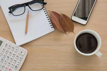 cup coffee on wooden table .Business Objects in the office .の写真素材