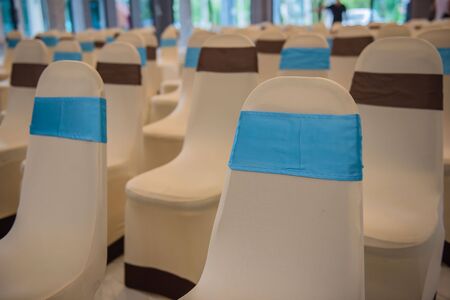 Beautiful decorated chairs in the room . Empty hall for presentation.の写真素材