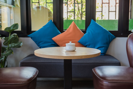 Wooden table and chair  in restaurant .