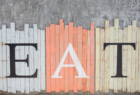 â EAT â Draw on wooden background vintage style .の写真素材