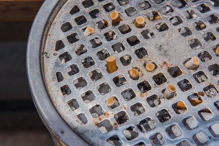 Closeup Cigarette in a ashtray Made of stainless steel .の写真素材