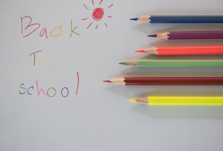 â back to school âWritten on white paper and Crayon.の写真素材