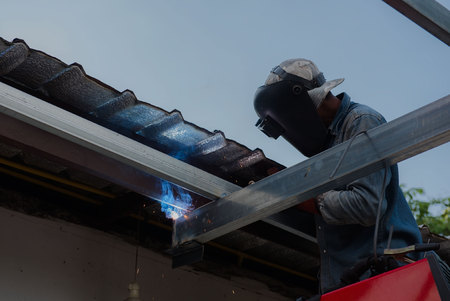Welding steel by the male worker in industrial metal steel.の写真素材