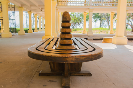Vintage Wooden chair in the yellow building .の写真素材