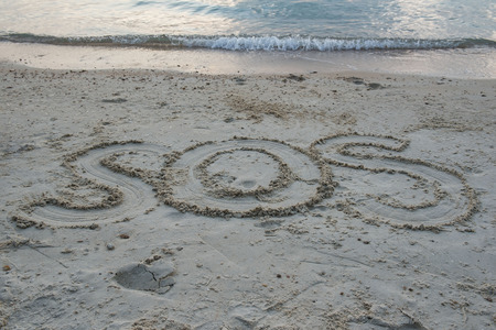 Word â SOS â Write in sand on the beach  .の写真素材