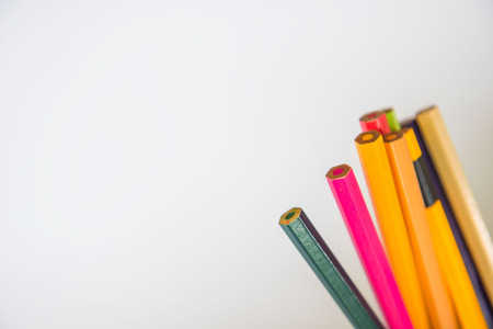 Colors pencils, colorful many crayons on white background .
