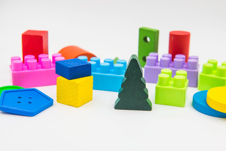 Children's toys are made of colorful wood on a white background.の写真素材