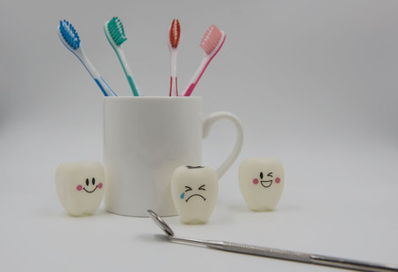 Model Cute toys teeth and glass on a white background.の写真素材