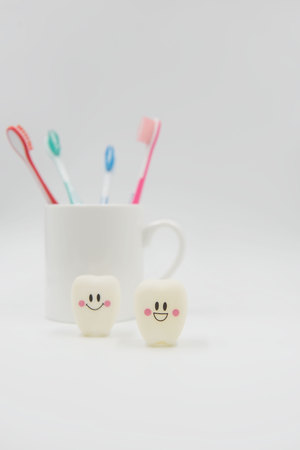 Model Cute toys teeth and glass on a white background.の写真素材