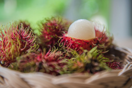 fresh rambutan sweet delicious in the basket . tropical fruit .の写真素材