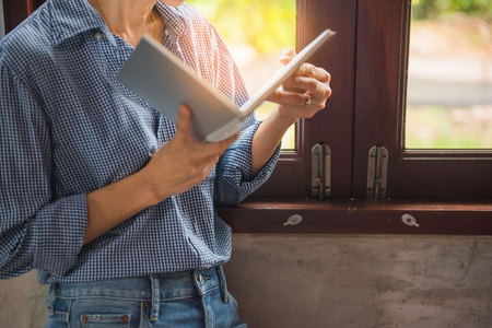 Women hold books in hand In the library .の写真素材