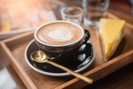 Cup coffee and set food and drink on wooden table in coffee shop at morning  .の写真素材
