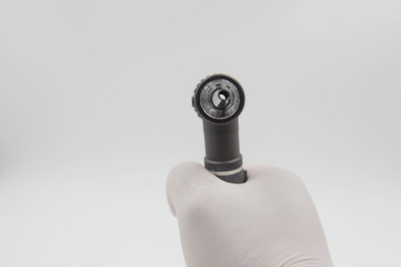 Otoscope  in hand doctor on the white background . medical equipment .