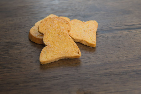 yellow Biscuits on wooden table background .