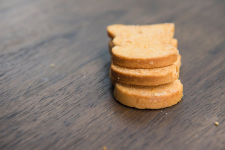 yellow Biscuits on wooden table background .の写真素材