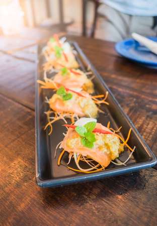 yum Salmon spicy salad in plate .の写真素材