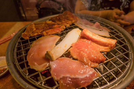 Grilling meat over Hot Charcoal Stove ,bbq .の写真素材