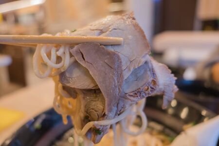 Japanese Ramen noodles and pork with chopsticks .の写真素材