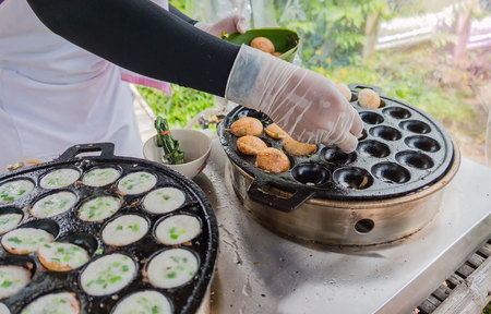 khanom krok in pan. Thai sweet dessert made from coconut milk .