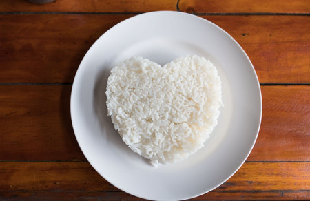 Cooked rice in a Plate on a table background.の写真素材