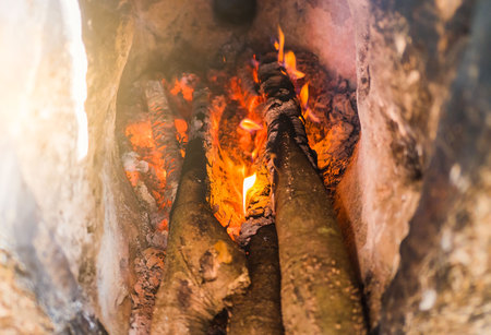 Closeup firewood and fire ,bright flame in the fireplace .の写真素材