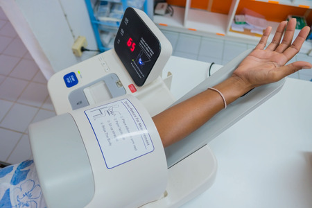 checking the blood pressure in the hospital with a digital equipment .の写真素材