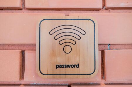 wireless sign on wooden board on the brick wall .の写真素材