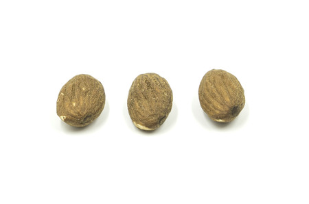 closeup almond nuts isolated on white background of file with Clipping Path .の写真素材