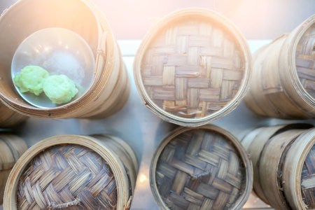 Dim sum bamboo basket containers in a restaurant Chinese food .の写真素材