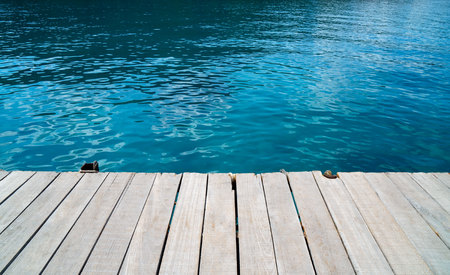 empty wood desk and summer blue sea background .Blank space for text and images.