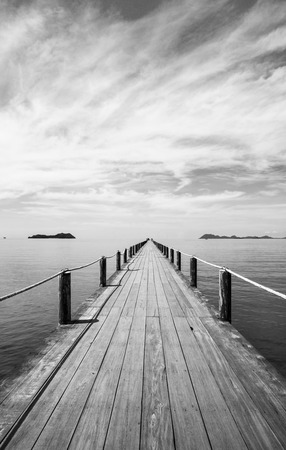 Black and white Landscape of wooden bridge in blue sea on tropical beachÂ .の写真素材