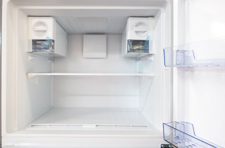 open empty new white refrigerator inside fridge with shelves .の写真素材