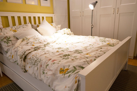 closeup Modern Bed , stylish bedroom interior design .
