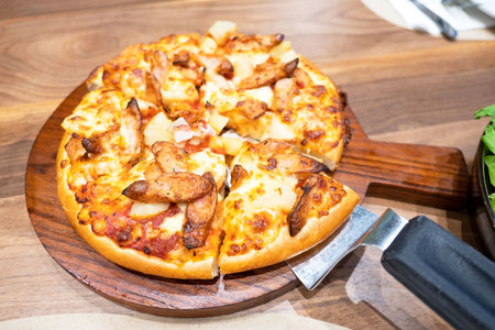 closeup fresh Italian PizzaÂ on Wooden Tray on wooden table , Traditional pizza .の写真素材
