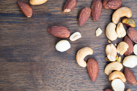 Many Dried peanuts on wooden table background and copy space ,space for text or images .の写真素材