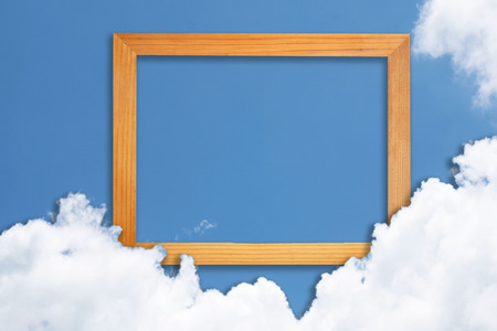 Square wooden frame, Creative Beautiful blue sky with white clouds for background . with paper card...