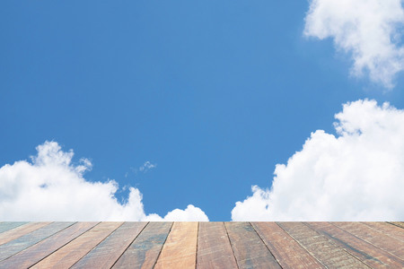 empty wood desk Beautiful blue sky with white clouds for background for background. Blank space for text and images.の写真素材