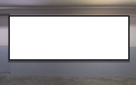 indoor car parking and empty white billboard .Blank space for text and images.