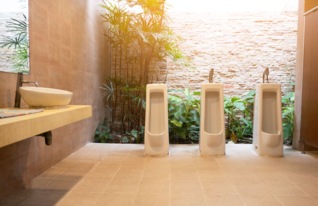 Interior Of Modern men Toilet bowl in bathroom .の写真素材