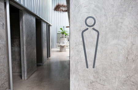 men toilet sign on gray wall background and copy space ,space for text or images .