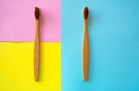 top view wooden ToothbrushÂ on colorful paper for background .