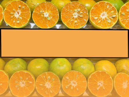 Fresh orange  fruit slice . Healthy food, many orange fruit . empty orange billboard .Blank space for text and images.の写真素材