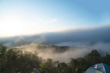 landscape,Â tourist tent in forest camp ,fog and cloud mountain valley , Morning fog .の写真素材