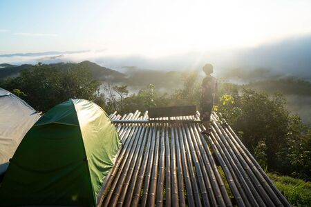 landscape,Â tourist tent in forest camp ,fog and cloud mountain valley , Morning fog .の写真素材