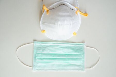 medical mask and N95 isolated white background . Face mask protection against pollution, virus, flu ,coronavirus ,covid 19. Health care and surgical concept.の写真素材