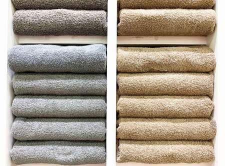 many colorful towels is folding in shelfs at store for Sales .の写真素材