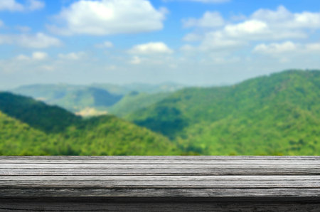 table wood textured on hills background. Ready for product display montage.の写真素材