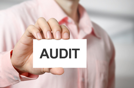 Audit text on the card in hand man.の写真素材